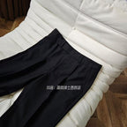 A three-piece black, light luxury, powerful British gentleman's suit for men