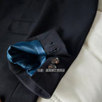 A three-piece black, light luxury, powerful British gentleman's suit for men