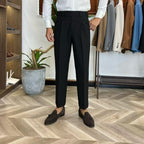 A three-piece black, light luxury, powerful British gentleman's suit for men