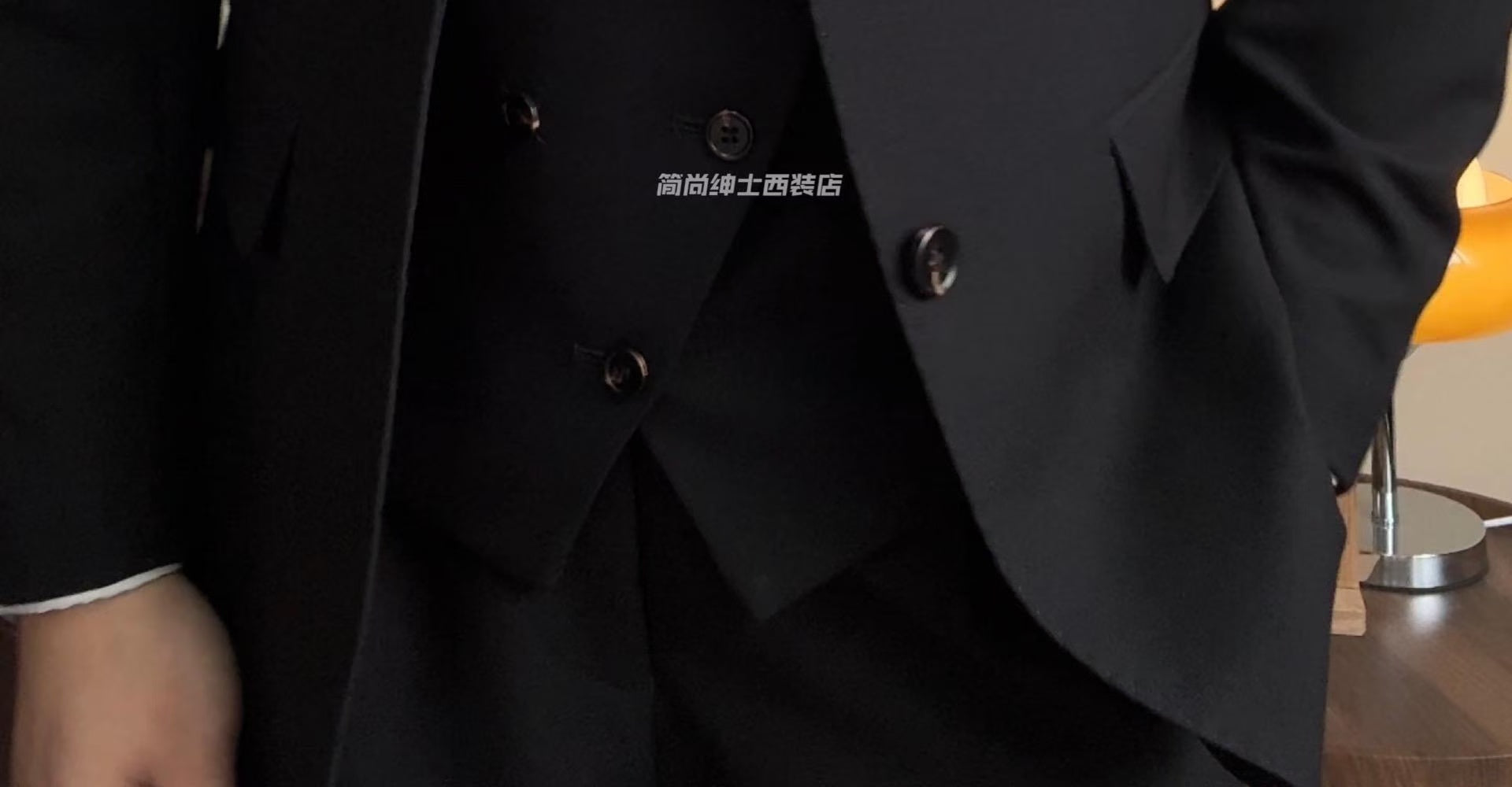 A three-piece black, light luxury, powerful British gentleman's suit for men