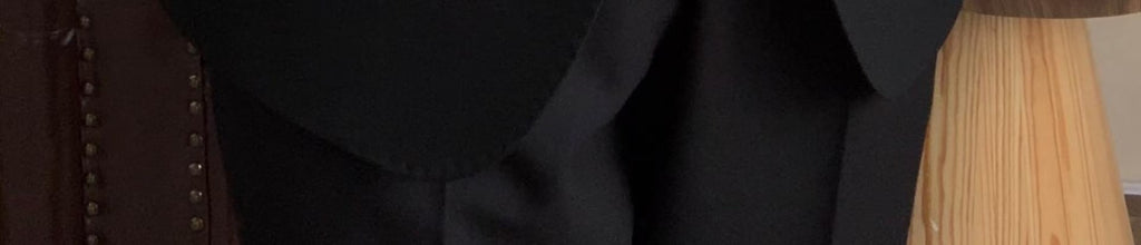 A three-piece black, light luxury, powerful British gentleman's suit for men